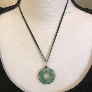 Necklace with cream and green round stone pendant